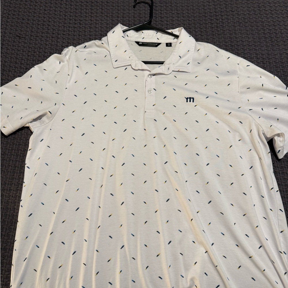 Travis Mathew White Polo with Blue and Black Accents